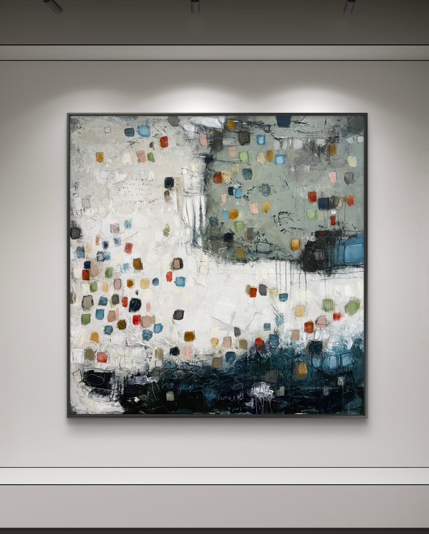 Abstract painting with colorful squares on a gray wall