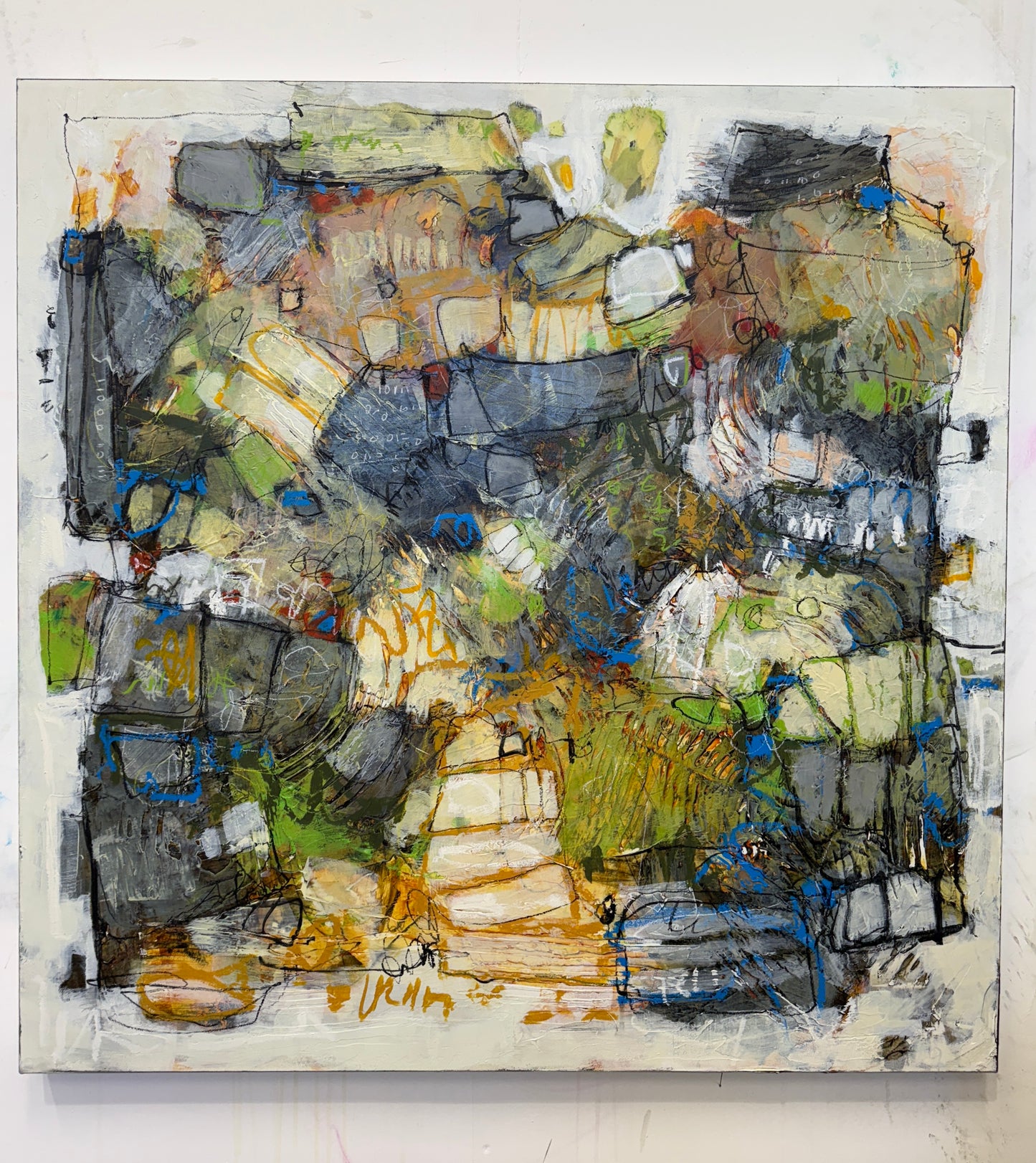 Abstract art piece with a variety of colors on a white background