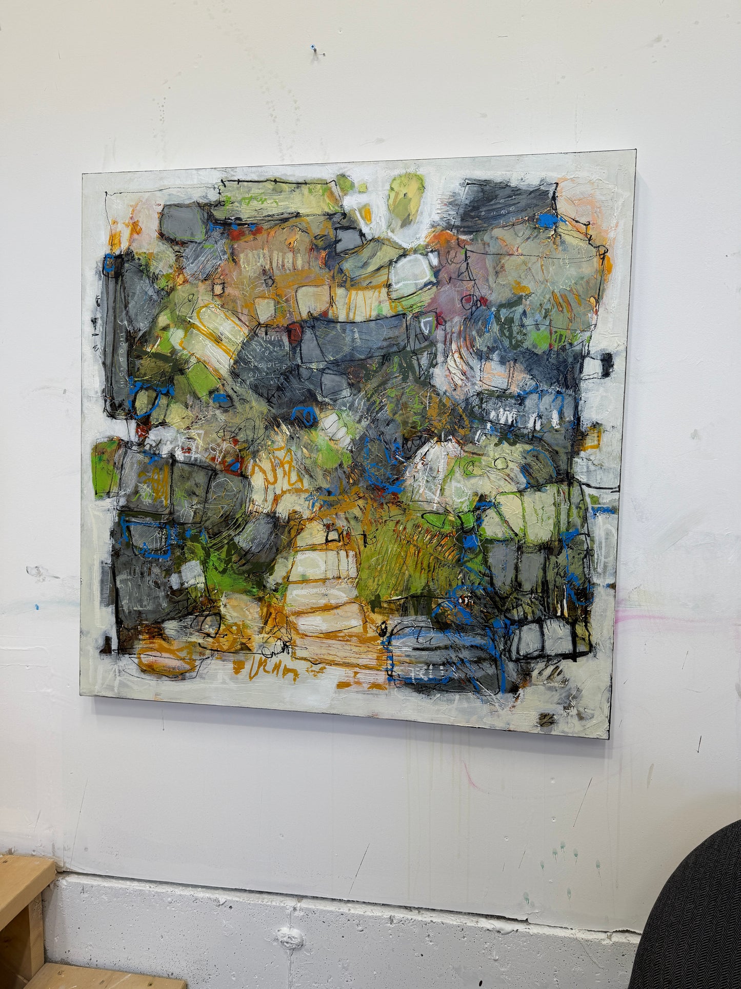 Abstract mosaic art piece on a white wall