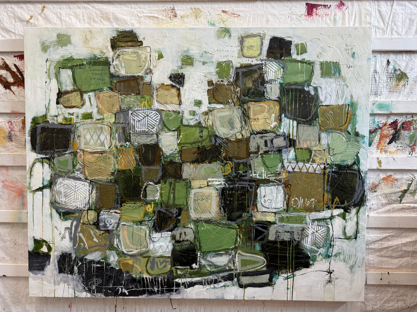 Abstract art piece with a mix of green, brown, and black colors on a white background.