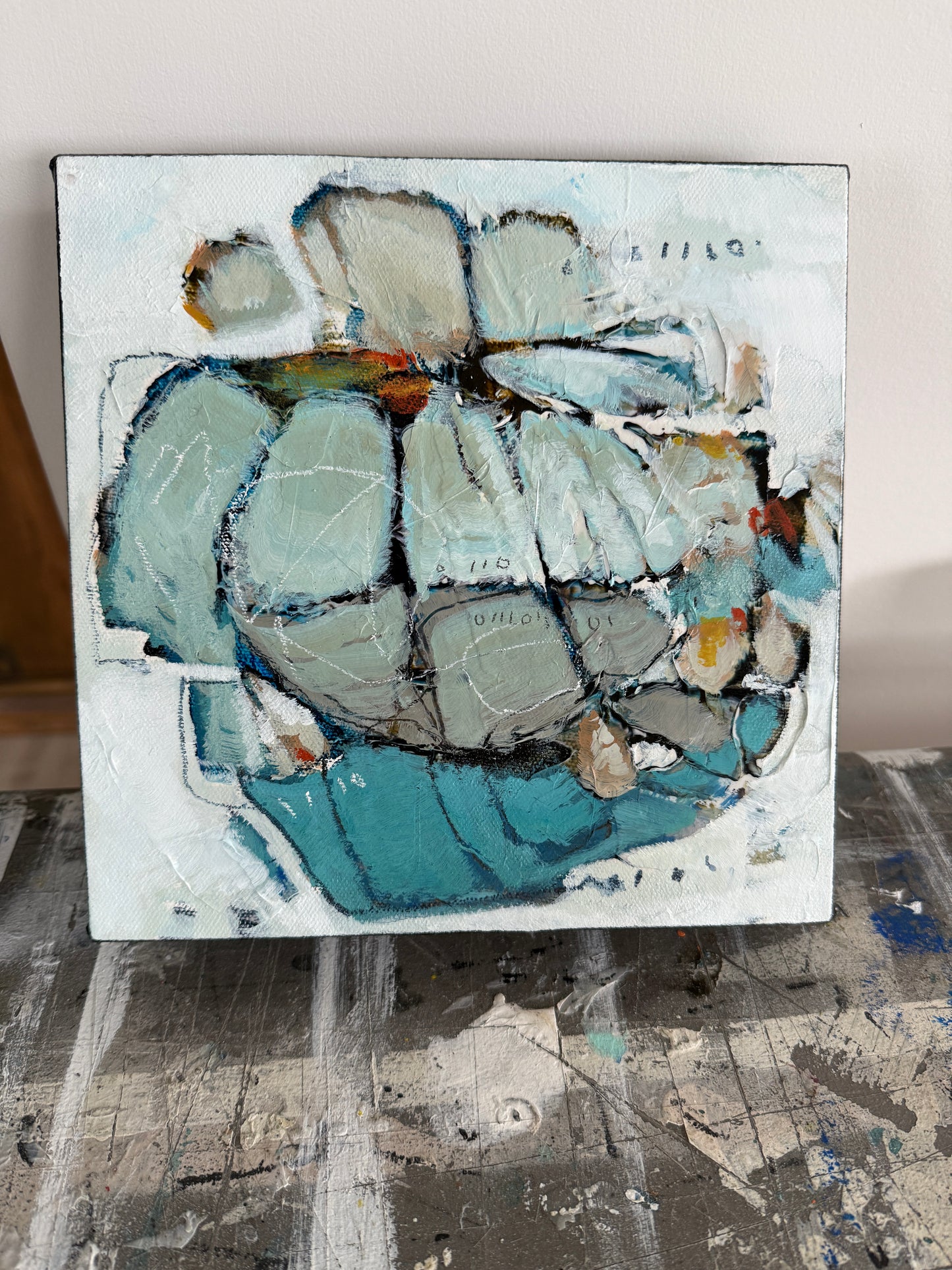 Abstract painting of a flower with blue and gray tones on a white background 8x8 Lori Mirabelli
