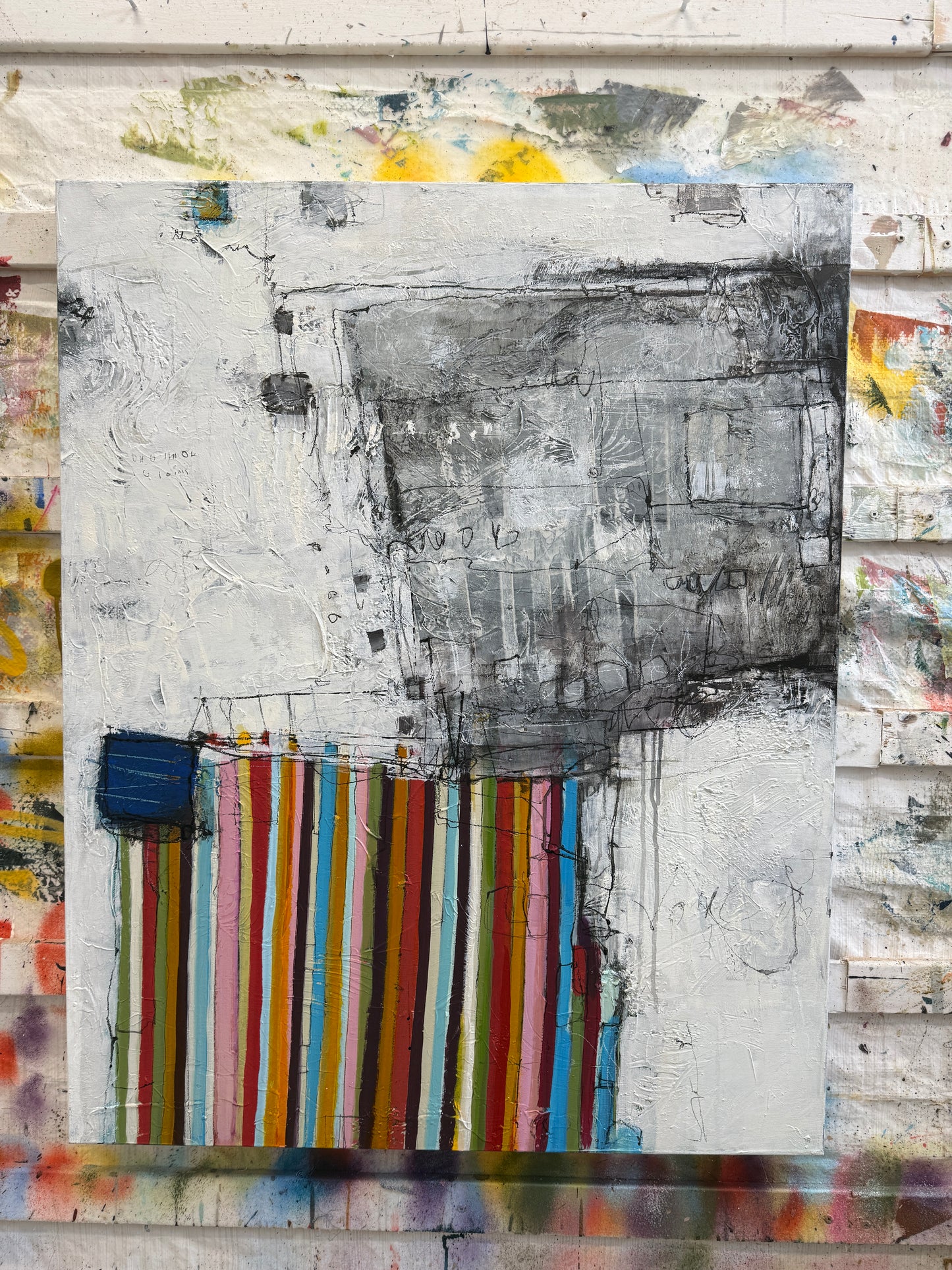 Abstract art piece with colorful stripes and textured background