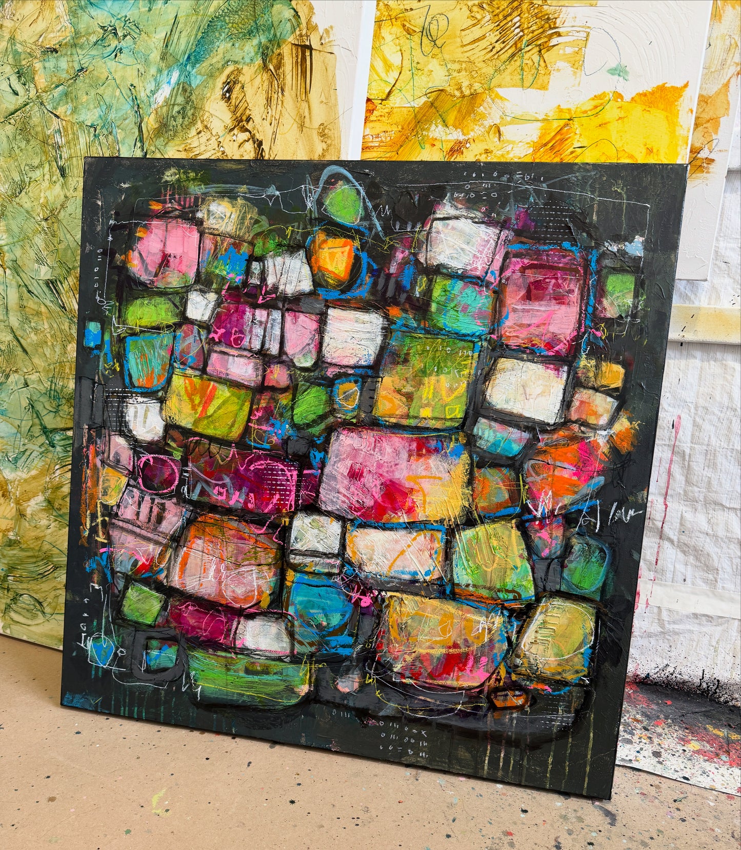 Abstract art piece with colorful squares on a black background