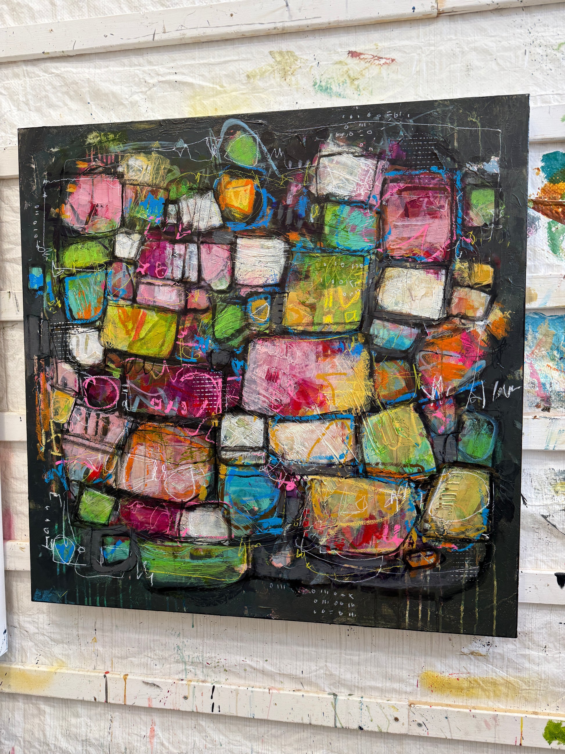 Abstract art piece with colorful geometric shapes on a black background