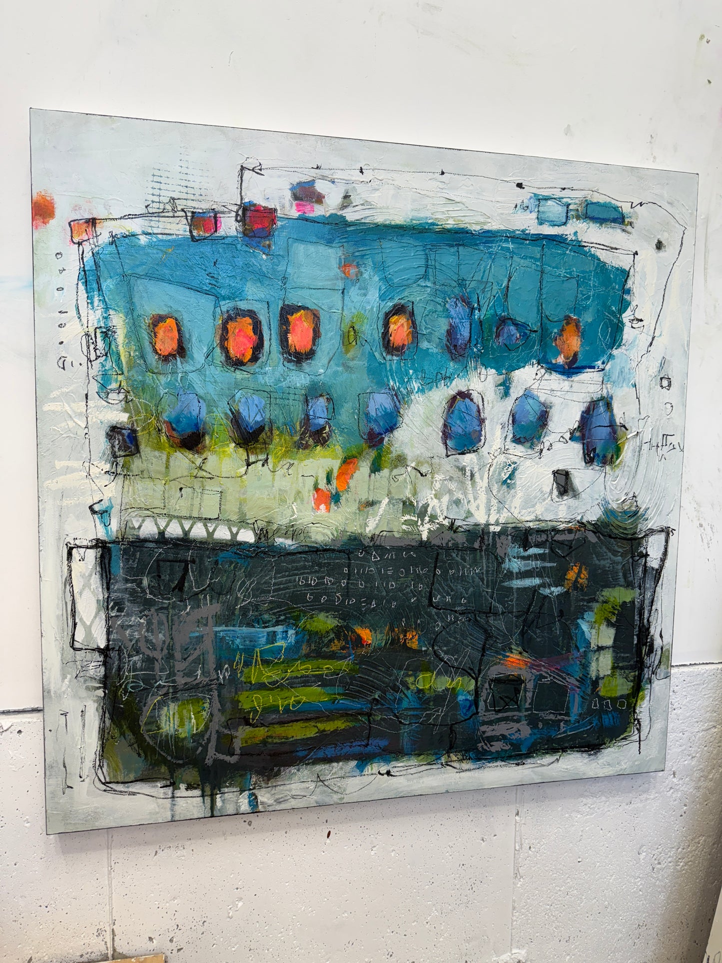 Abstract artwork with a mix of blue, black, and orange colors on a white background lori mirabelli.