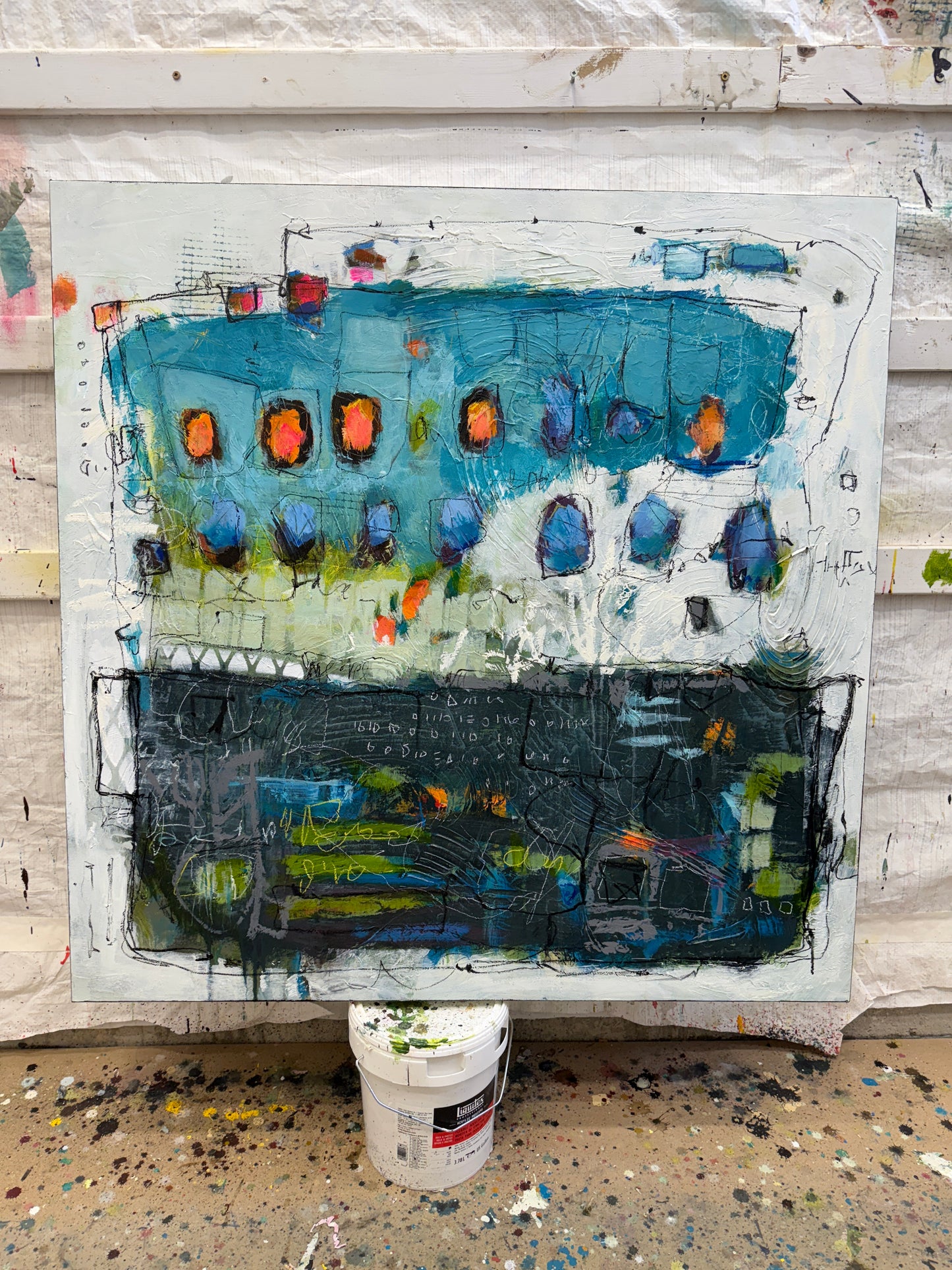 Abstract artwork with a mix of blue, black, and orange colors on a white background lori mirabelli.