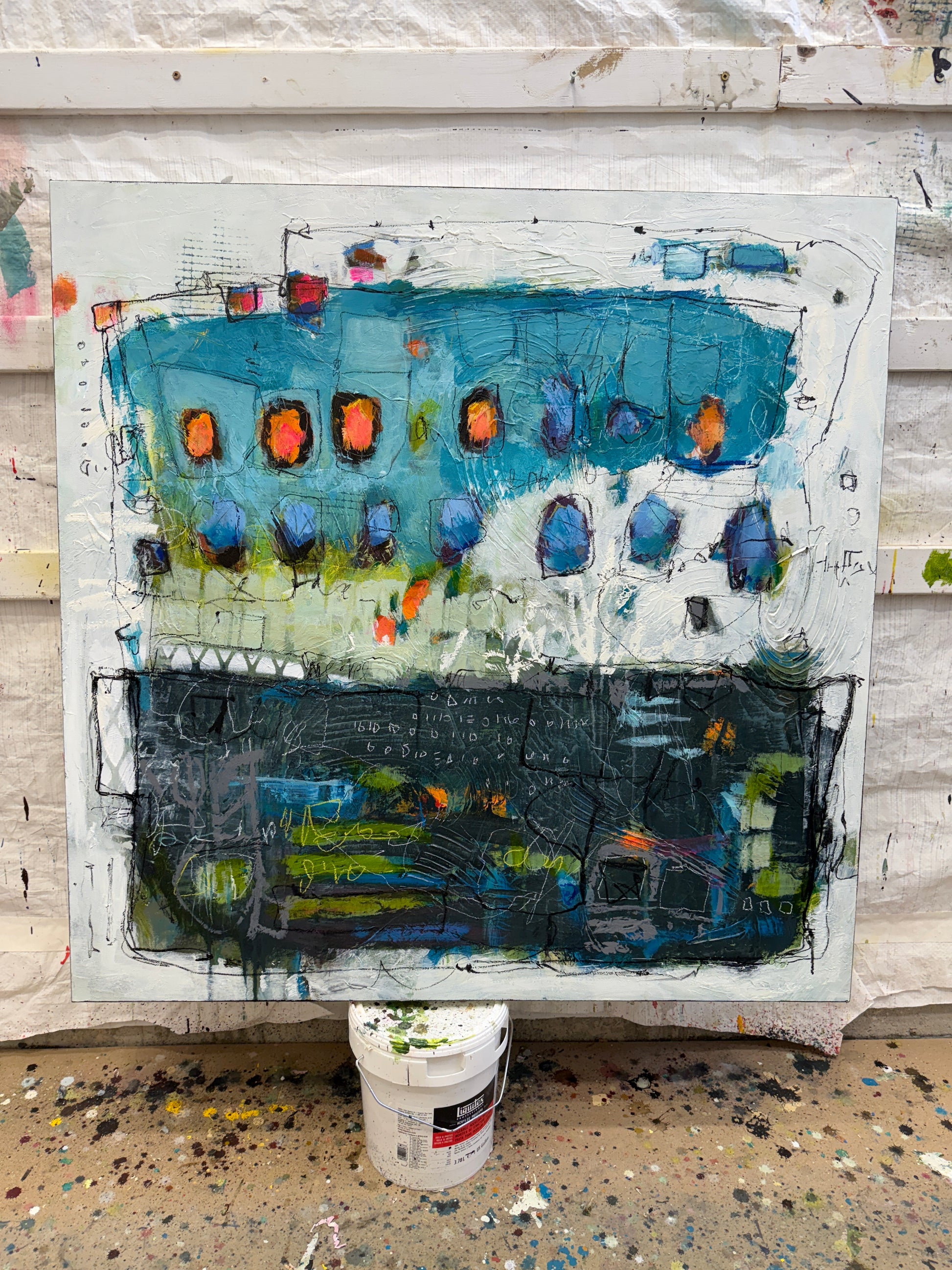 Abstract artwork with a mix of blue, black, and orange colors on a white background lori mirabelli.
