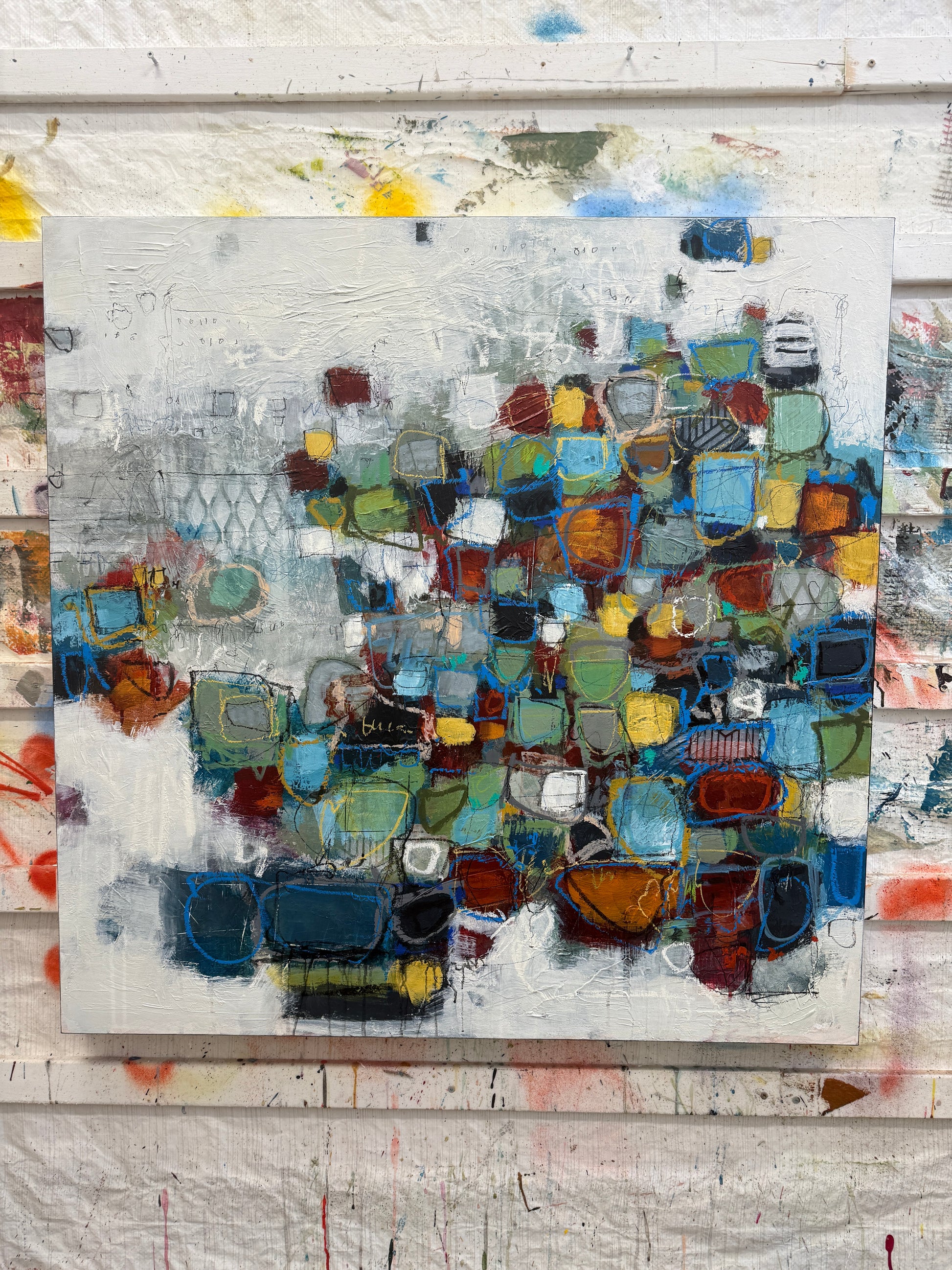 Original abstract mixed-media painting for sale, featuring layered geometric shapes in blues, greens, ochres, and rust tones on a textured neutral background.