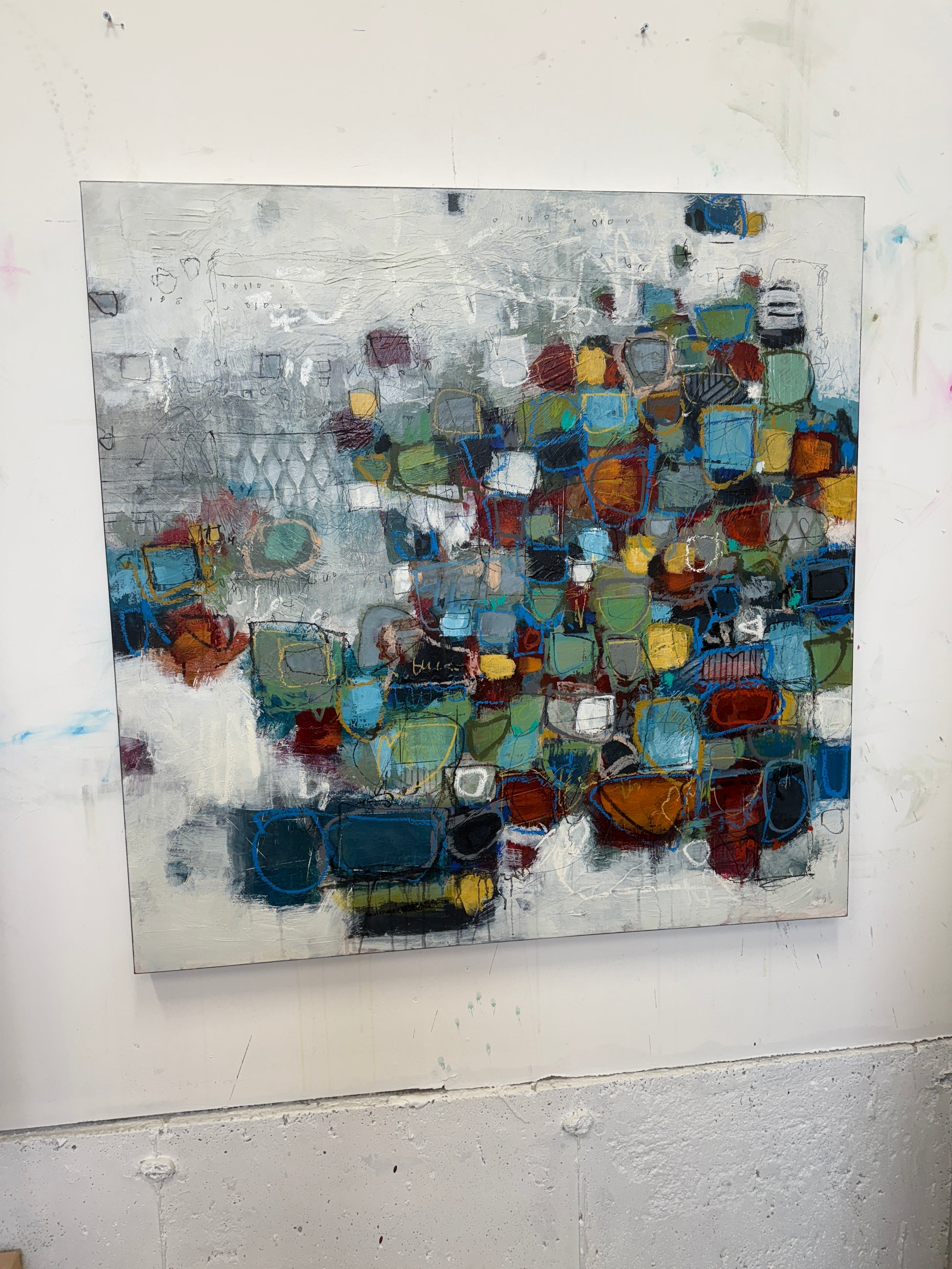 Original abstract mixed-media painting for sale, featuring layered geometric shapes in blues, greens, ochres, and rust tones on a textured neutral background.