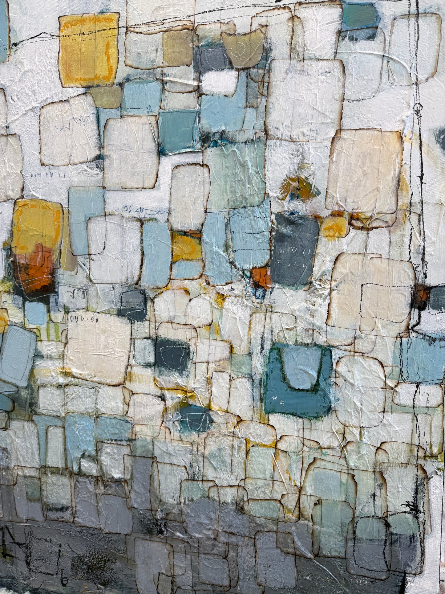 Abstract textured painting with a mosaic of irregular rectangular blocks in off-white, light blue, gray, teal, beige, and muted yellow, separated by dark linework.