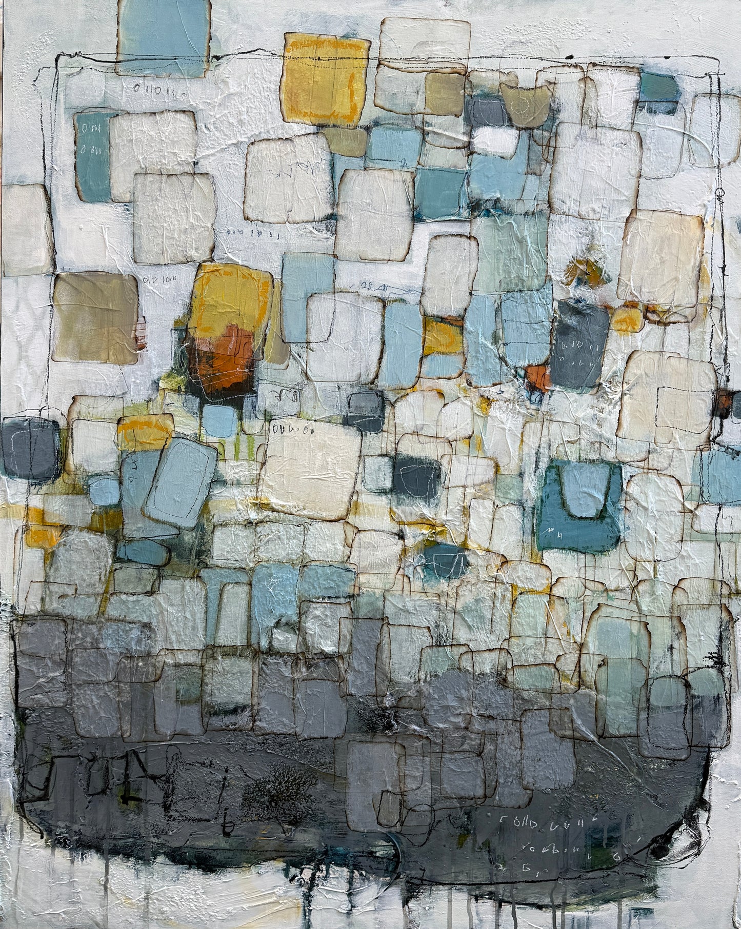 An abstract textured painting featuring a grid-like pattern of rectangular blocks in shades of gray, blue, white, beige, and yellow, with a dark charcoal base at the bottom.