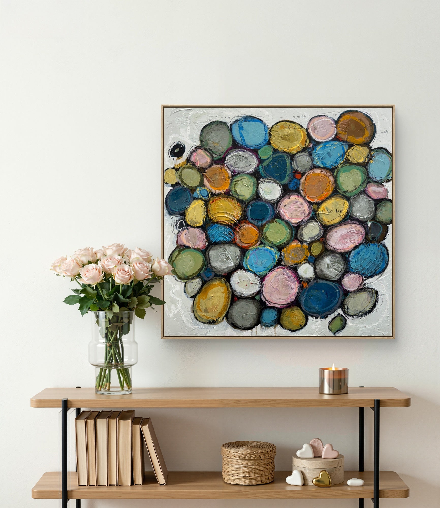 Contemporary abstract acrylic painting on canvas featuring layered colourful circular forms in soft blue, pink, green, gold, and neutral tones, surrounded by textured white space with expressive mark making and organic composition.