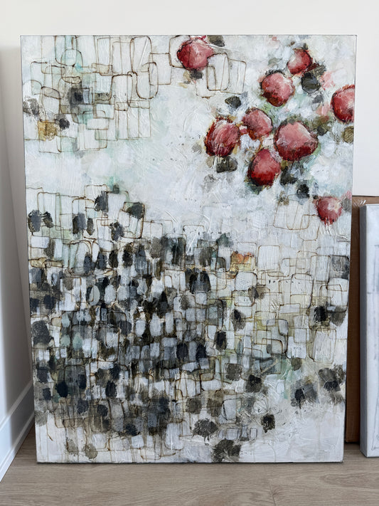 Abstract art piece with geometric patterns on a wooden surface