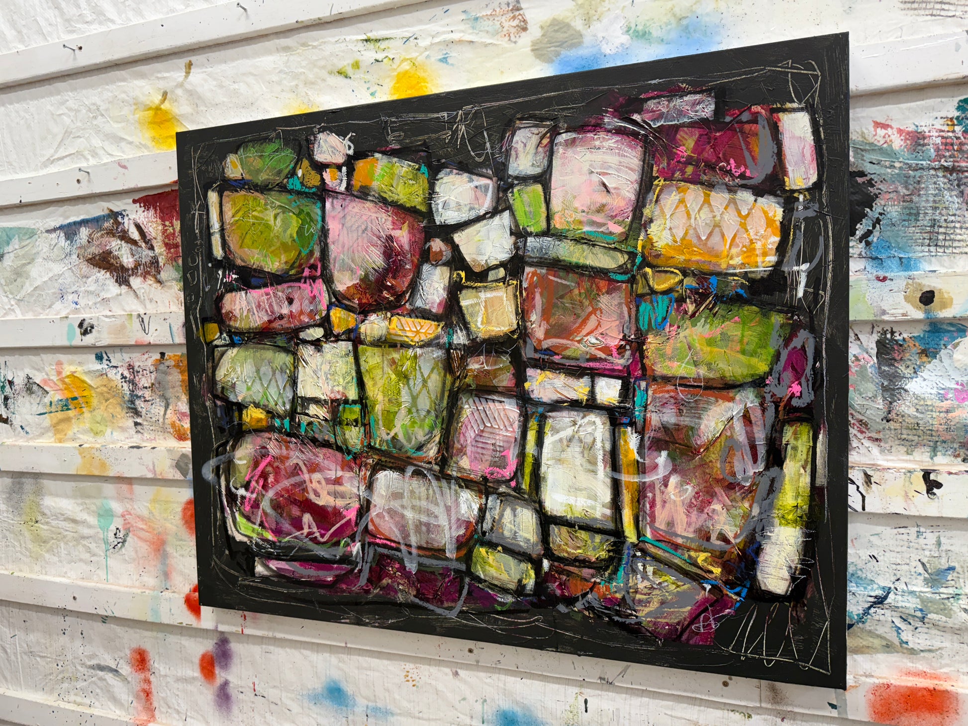 Abstract art piece with colorful geometric shapes on a black background Artist Lori mirabelli