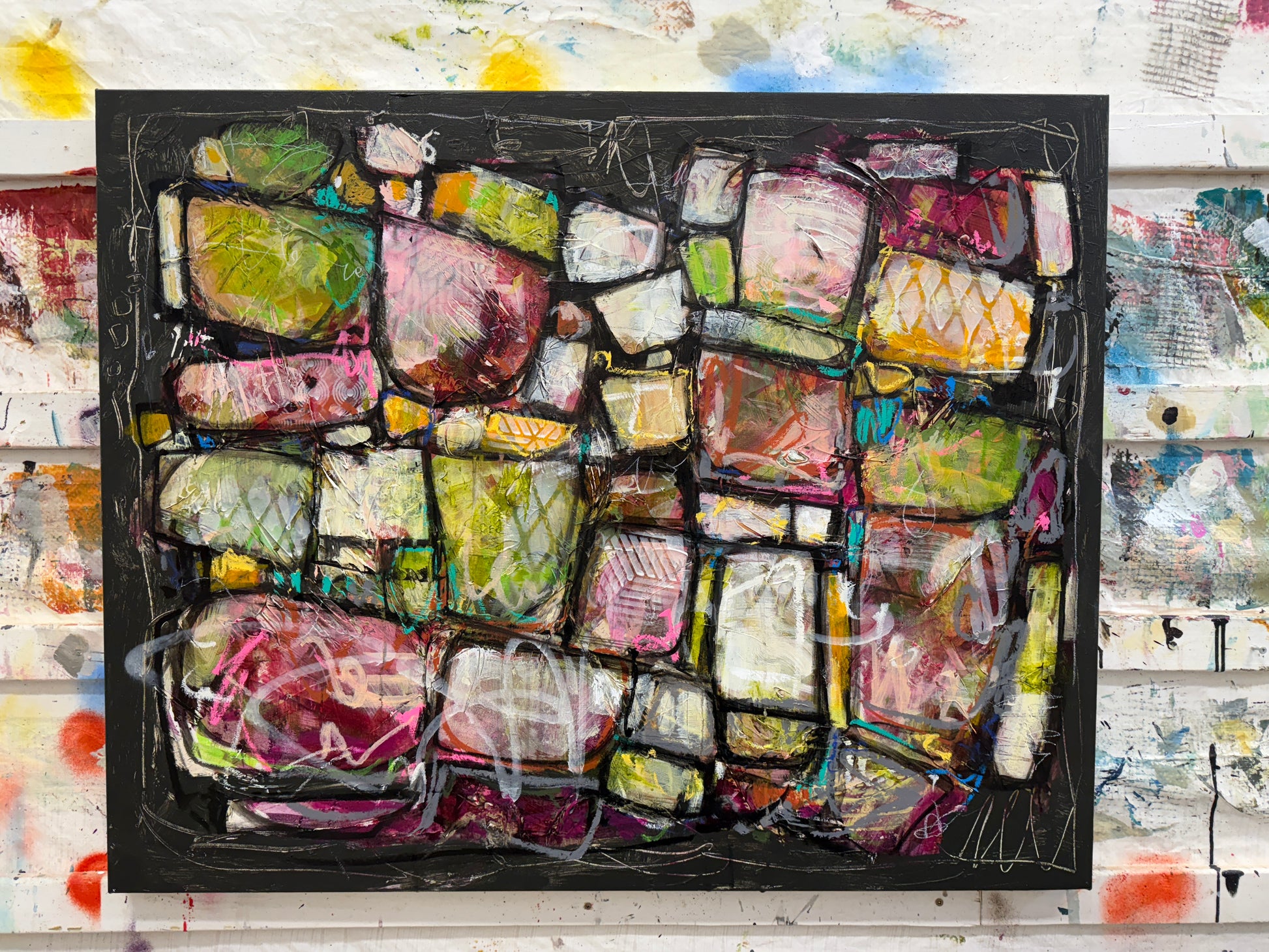 Abstract art piece with colorful geometric shapes on a black background Artist Lori mirabelli