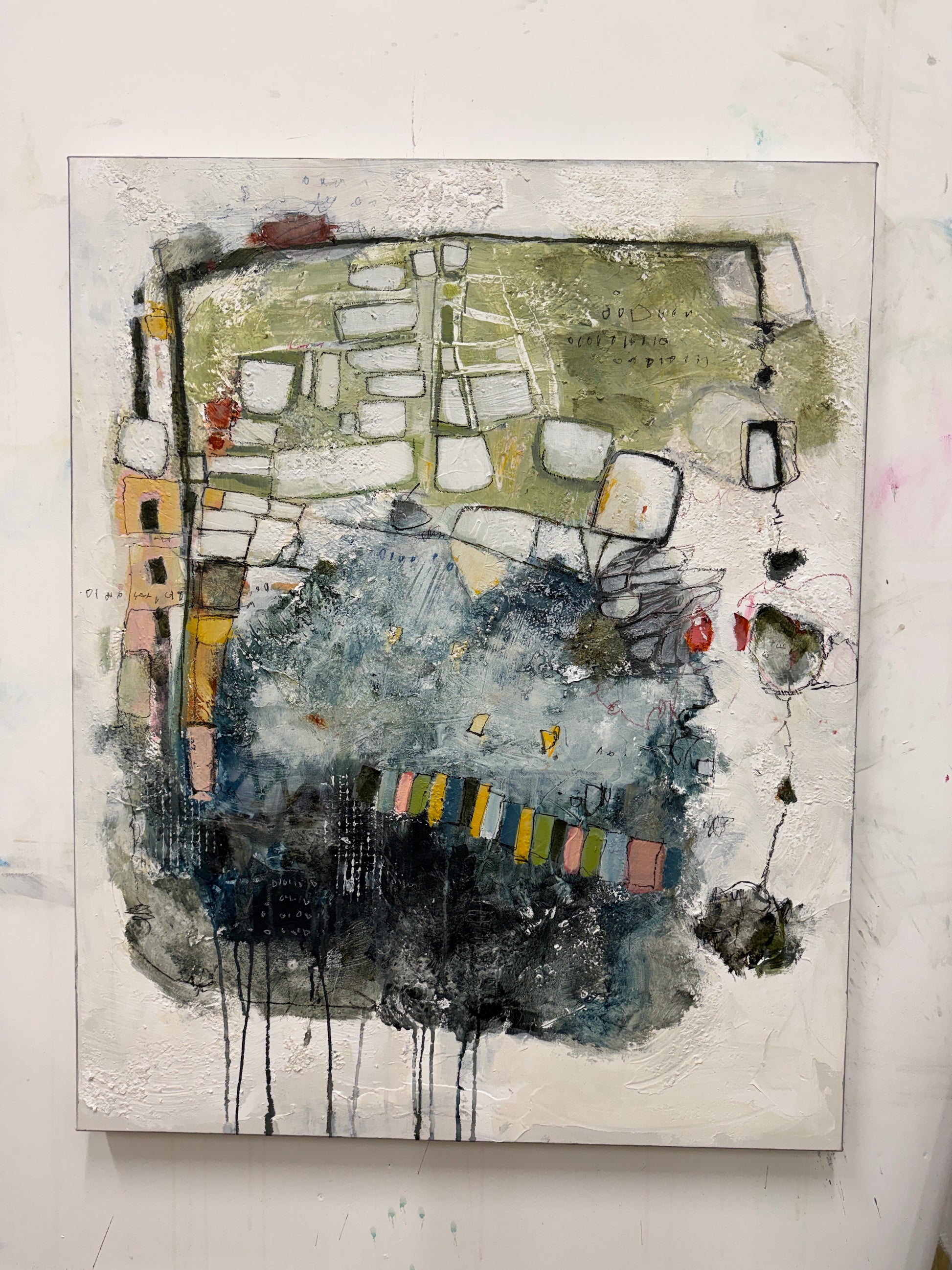 An abstract mixed-media painting on textured canvas, featuring a complex composition of black ink drips, olive green, slate blue, gray, and small multicolored accents on a white background.