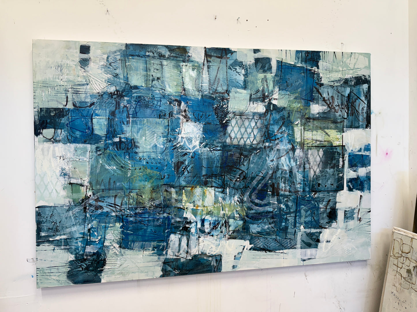 Abstract blue painting on a wall above a bed in a bedroom interior design art Lori mirabelli 40x60 inches