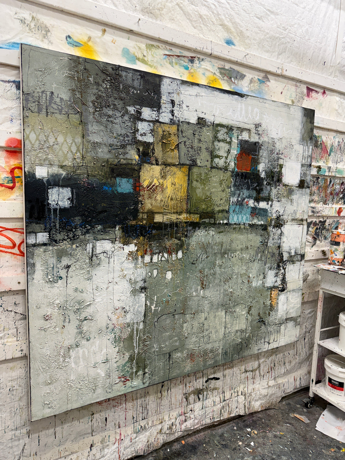 abstract painting, acrylic on canvas, textured surface, geometric composition, large scale, statement piece, earthy palette, olive green, charcoal grey, ochre yellow, turquoise accents, contemporary interiors, Canadian painter, Lori Mirabelli, Ottawa, Toronto, Montreal, Smiths Falls, 54x60