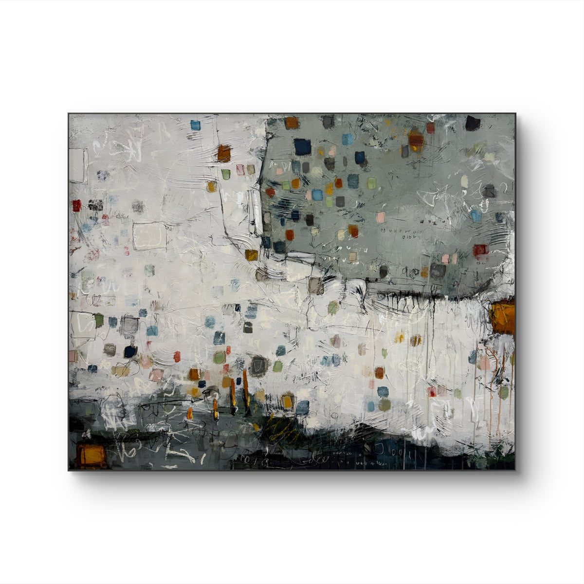 Large 48 × 60-inch abstract painting with textured white and sage-grey fields, scattered small squares in blue, mustard, rust, pink and green, and loose black and white lines. Dark charcoal layers anchor the bottom edge. The painting hangs above a black leather chair with wooden arms against a light wall.