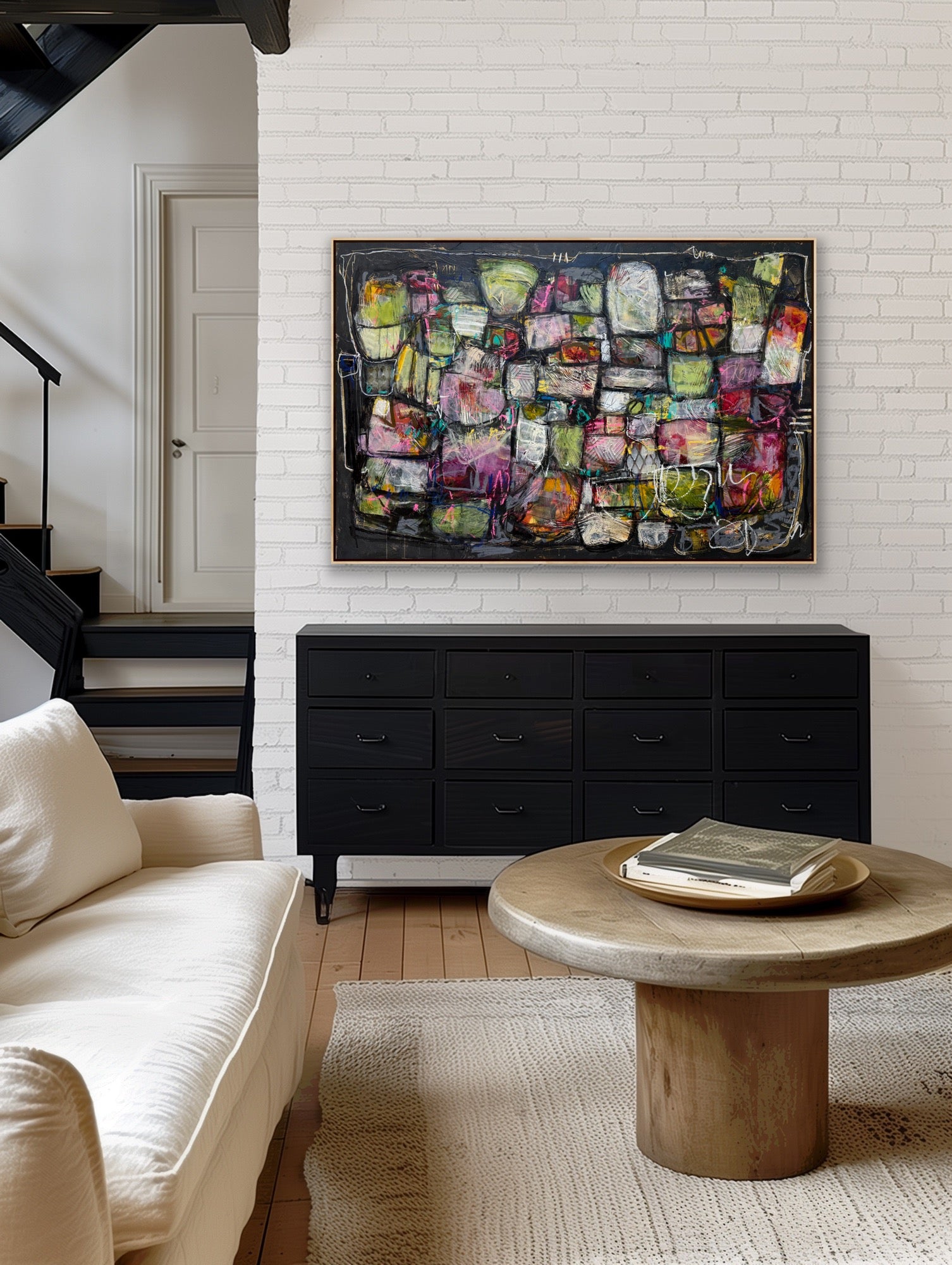 Person sitting in front of a large abstract artwork on a white wall. 40x60 abstract paintings for sale lori mirabelli
