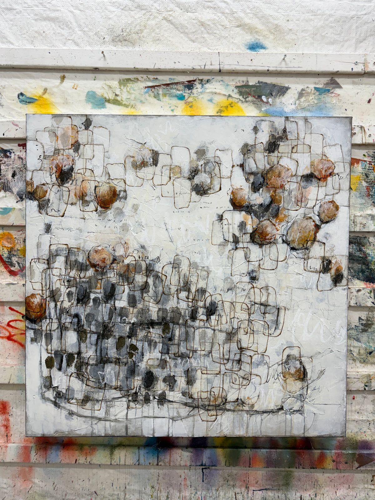 Large contemporary abstract painting with layered black linework, textured white background, soft grey forms and warm rust and ochre accents. Original modern abstract art by Canadian artist Lori Mirabelli, available for collectors and contemporary interiors in Stamford, Connecticut and Greenwich, Connecticut.