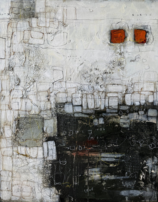 Abstract art piece with textured surface on a light wood floor