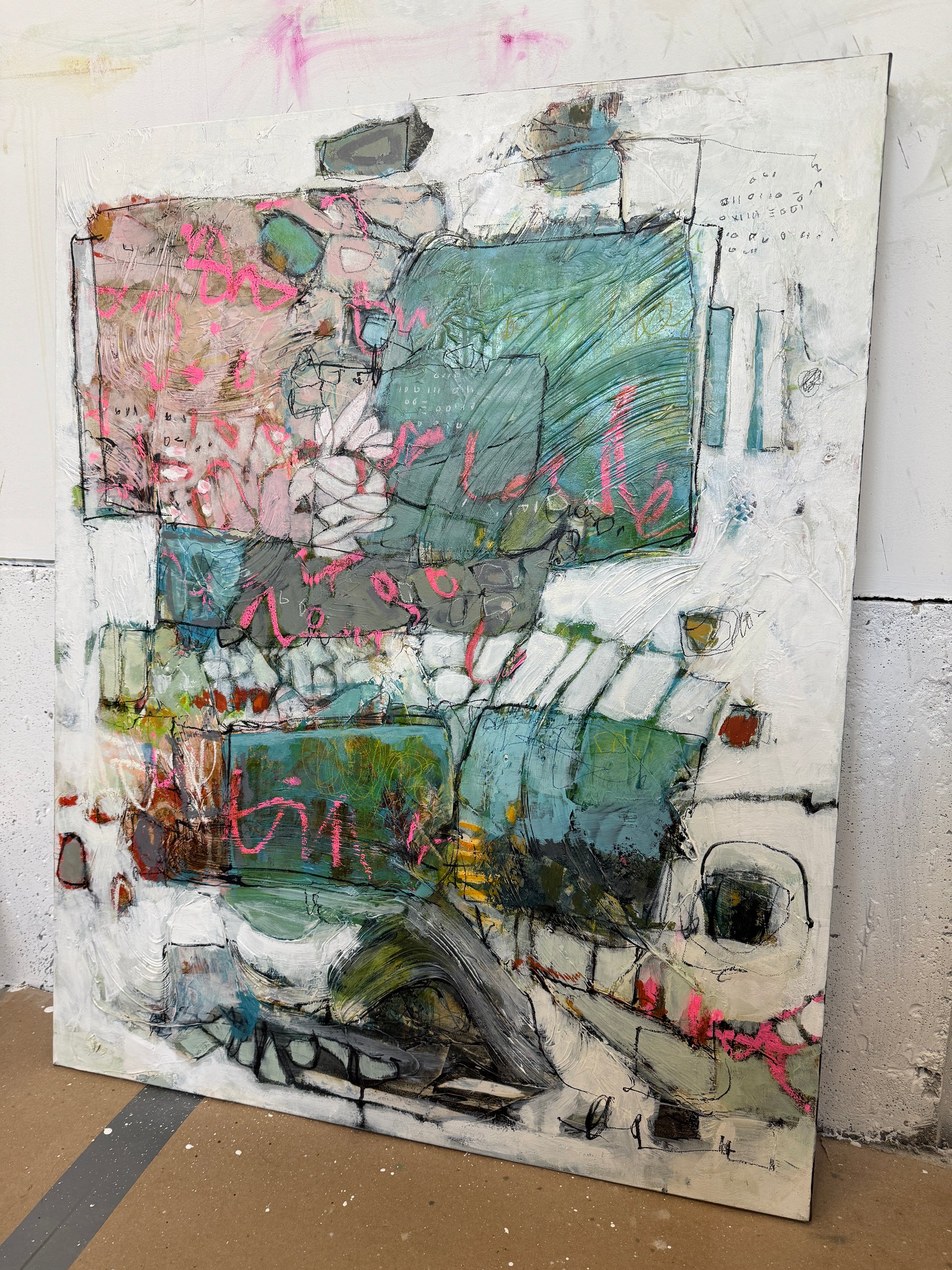 Abstract art piece with various colors on a textured surface