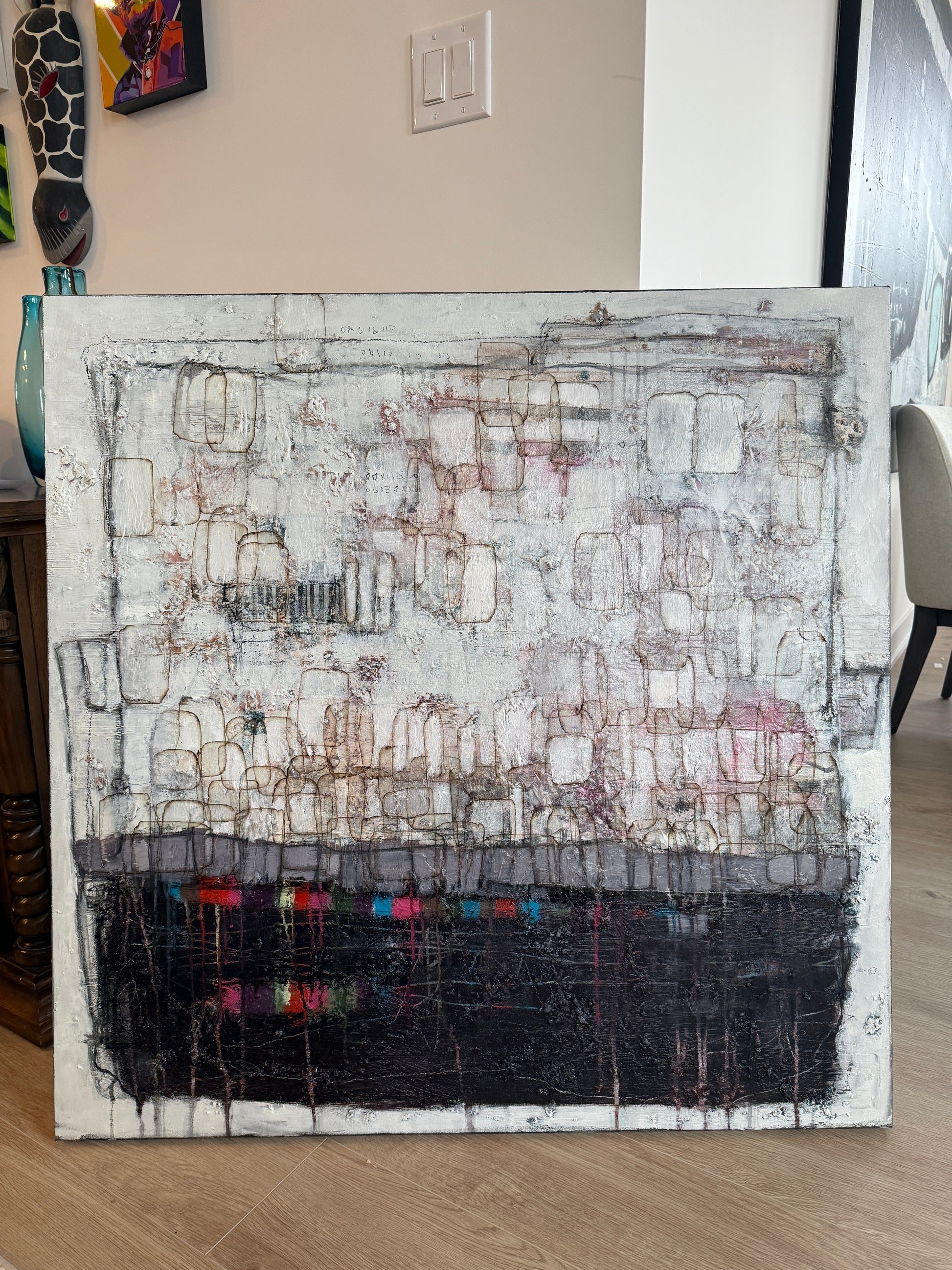 Abstract art piece on a table with a neutral background