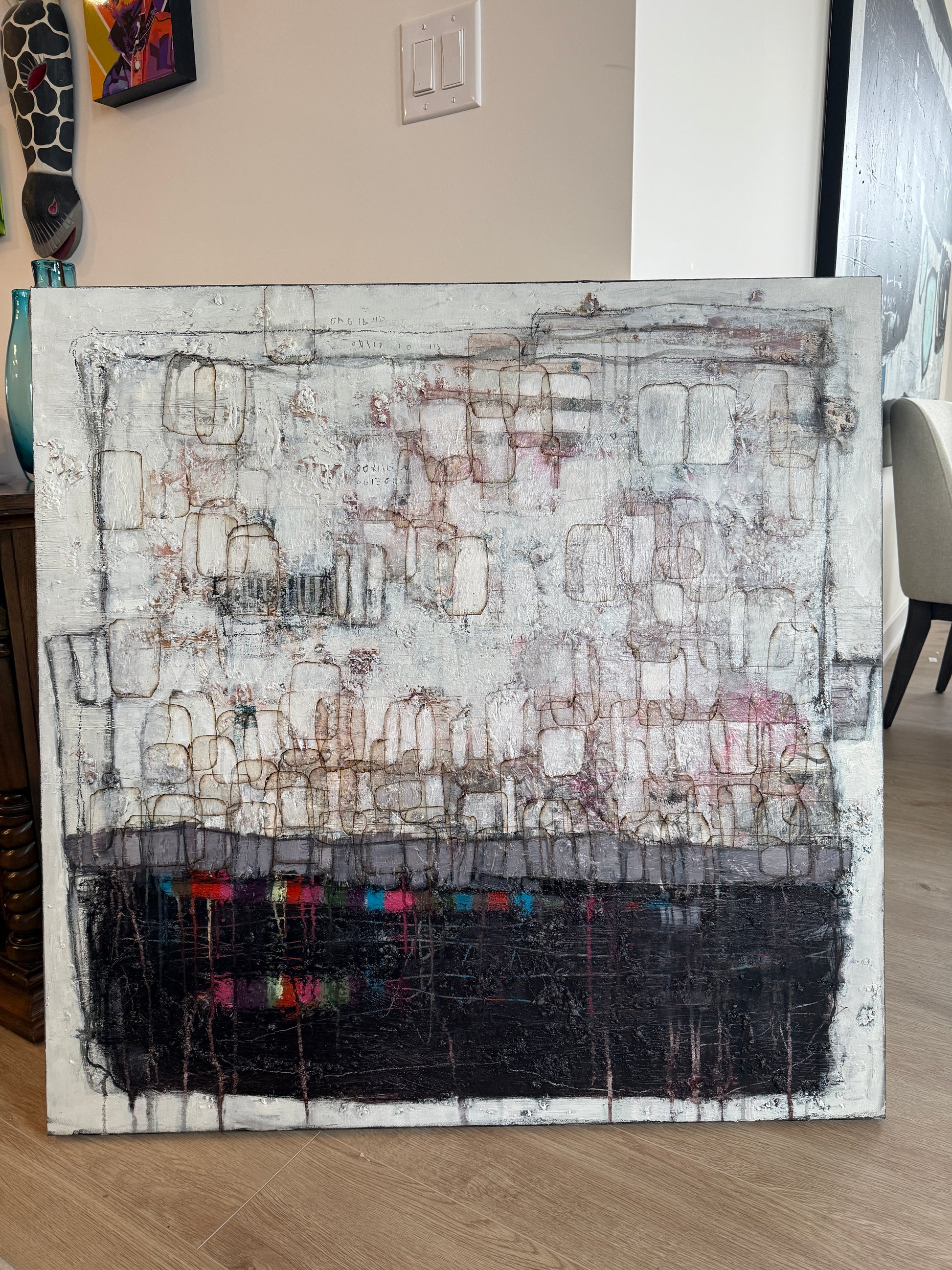 Abstract art piece on a table with a neutral background