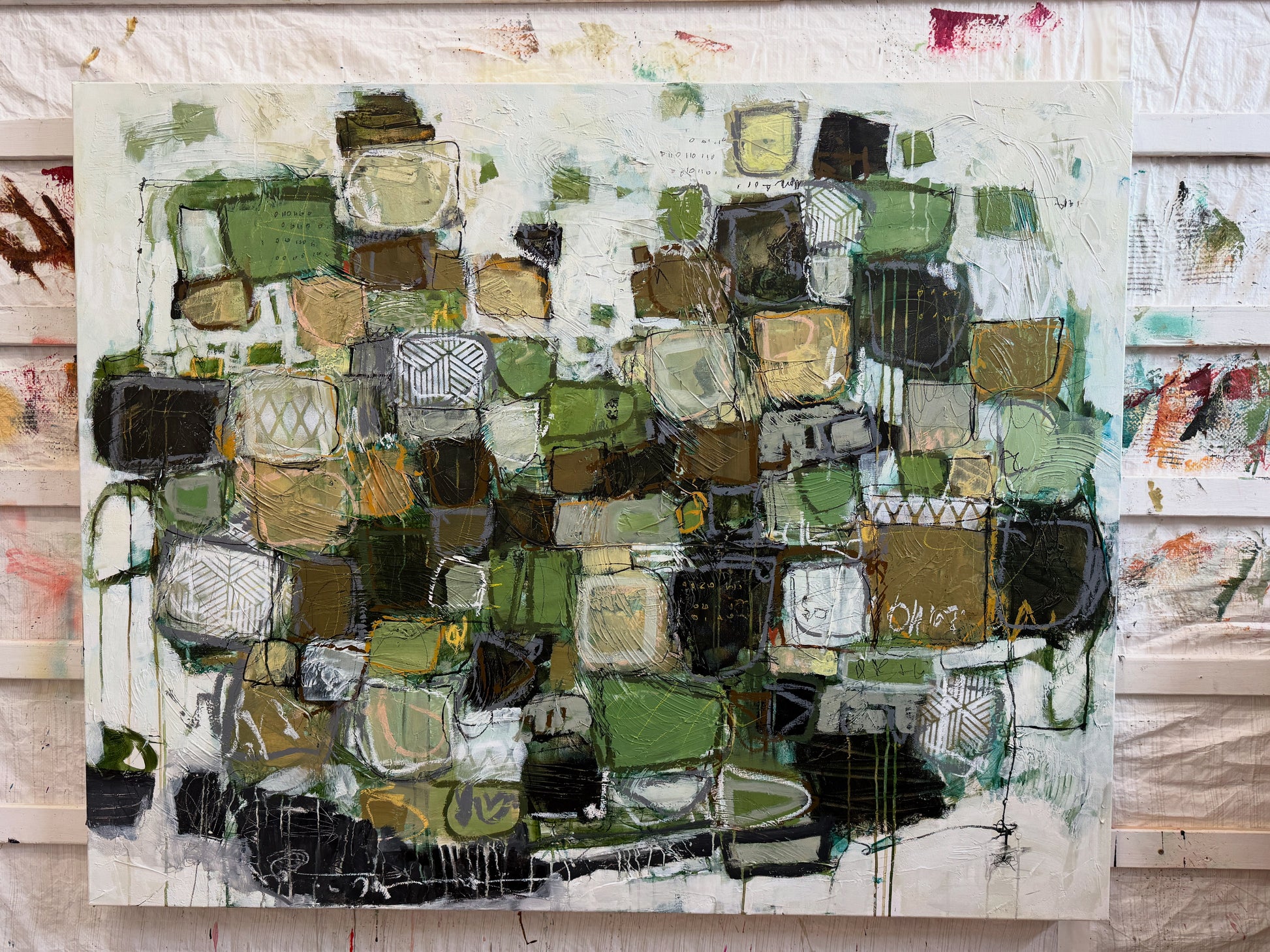 Abstract art piece with geometric shapes in green, brown, and black on a white background.