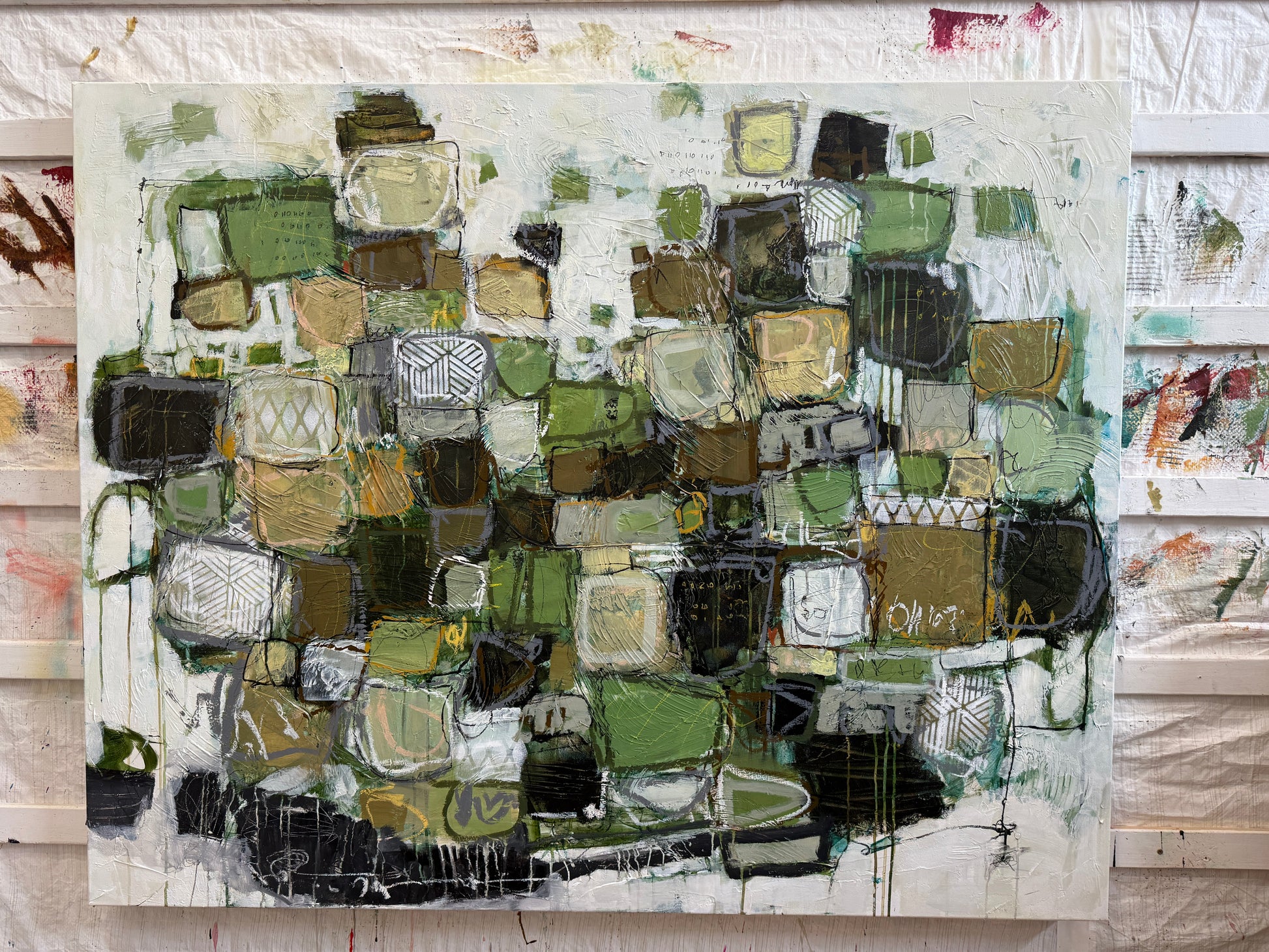 Abstract art piece with a mix of green, brown, and black colors on a white background.
