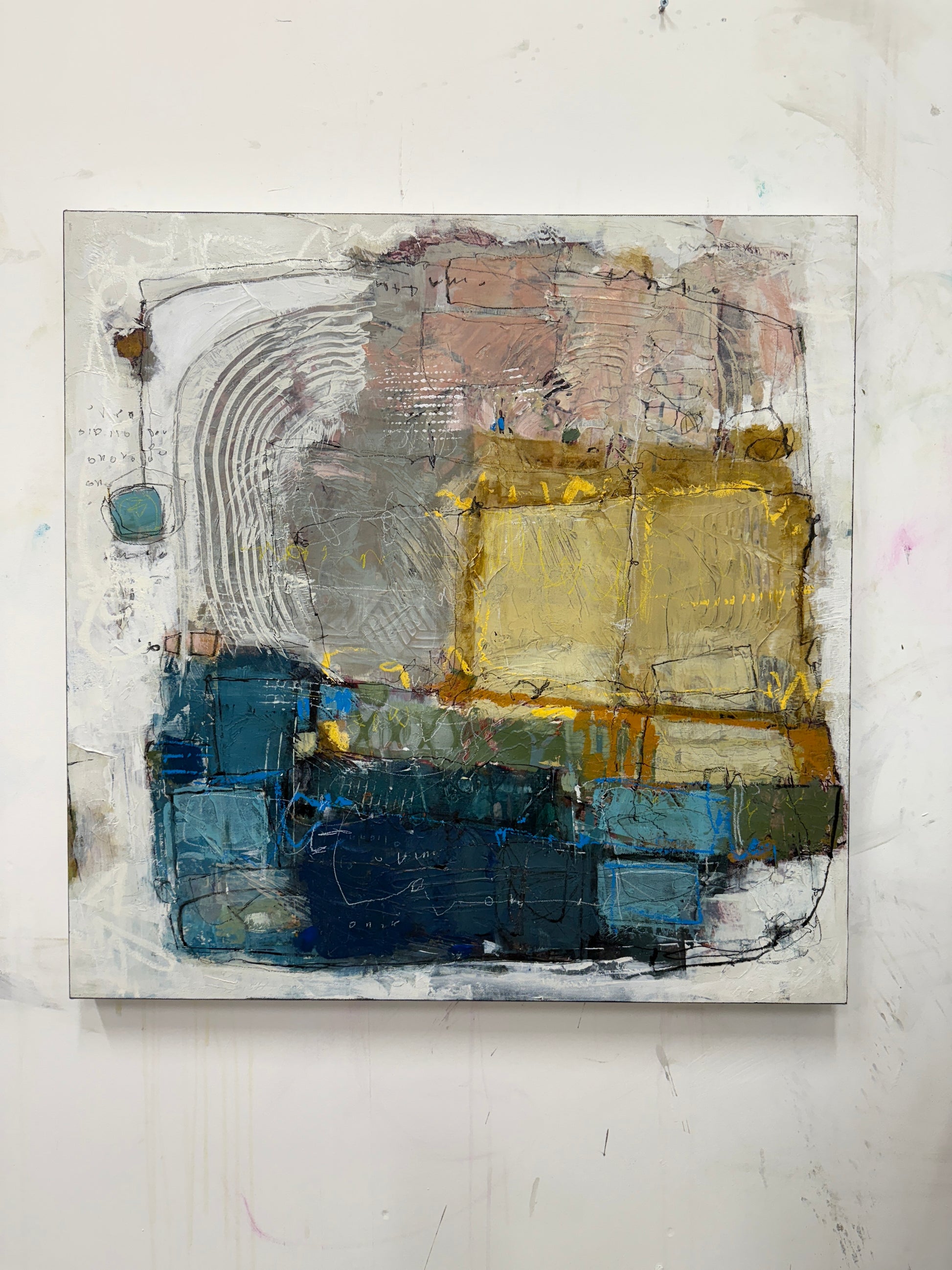 Abstract art piece with blue, gold, and gray tones on a white background